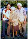Maciej with his grandparents at their garden.